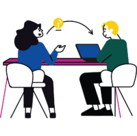 Two people talking at a table